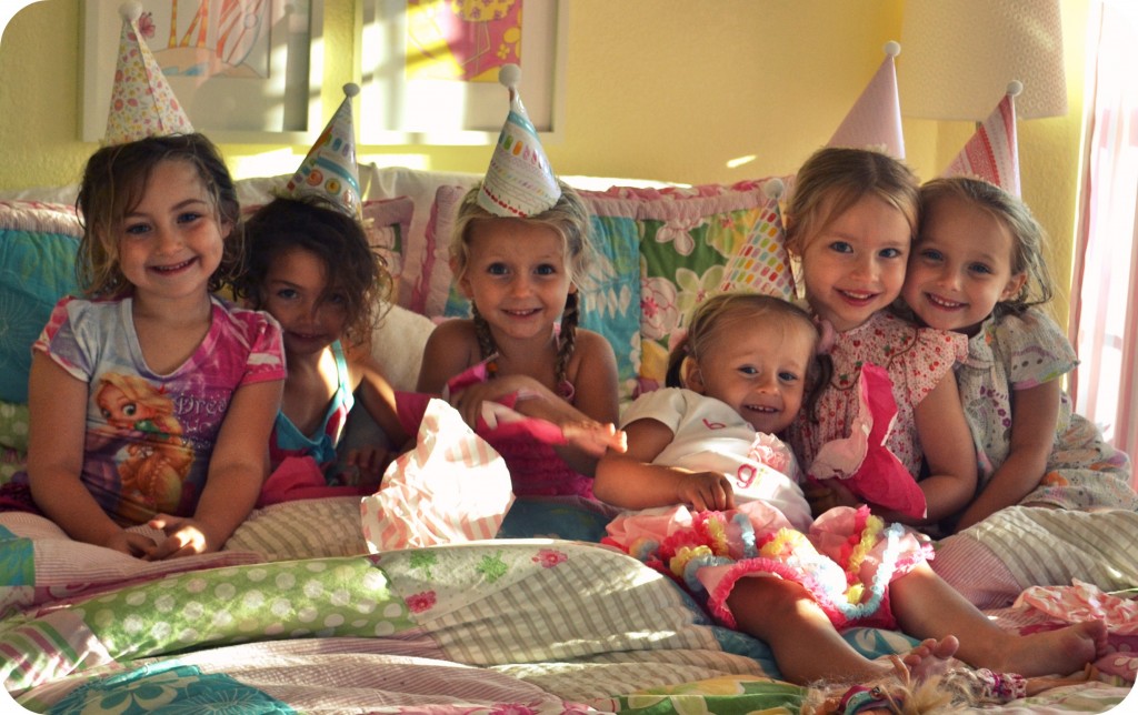 Throwing an entertaining party for kids is easy, even on a budget: just look at all these happy smiles in their party hats!