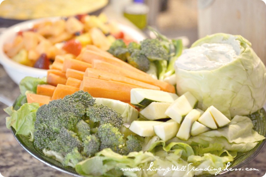 Pot luck and simple dishes like this vegetable platter and fruit salad, make entertaining possible even on a budget. 